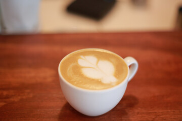 Cappuccino in a cup on the cafateria bar