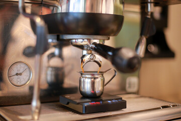 Close-up of a coffee machine in use