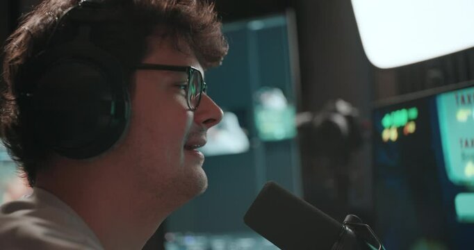 Young man playing video games and setting up a livestream