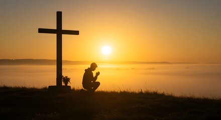 A person kneels in prayer before a large cross in a serene outdoor setting at sunrise, enveloped in golden mist, reflecting solitude, faith, and devotion.