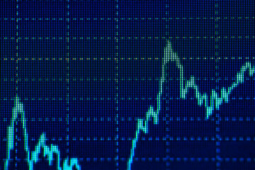 Blue graph display showing fluctuating financial data trends on digital screen
