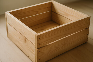 Wooden crate on a light wooden floor, simple storage solution
