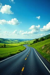 Fototapeta premium Curving highway road stretching through countryside with green fields and blue sky, road, journey