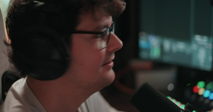 Young man playing video games and setting up a livestream