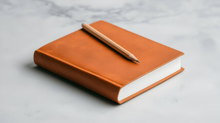 Tan Leather Journal with Pencil on Marble Surface
