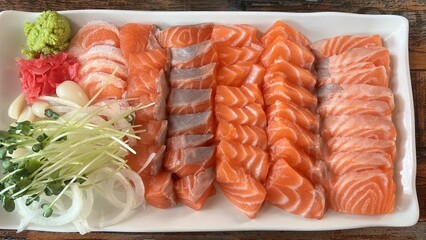 Fresh and delicate sashimi slices, beautifully presented with vibrant colors and perfect cuts. This traditional Japanese delicacy highlights the pure flavors of premium seafood.