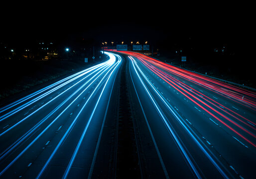 Highway light trails at night with red and blue car lights long exposure shot