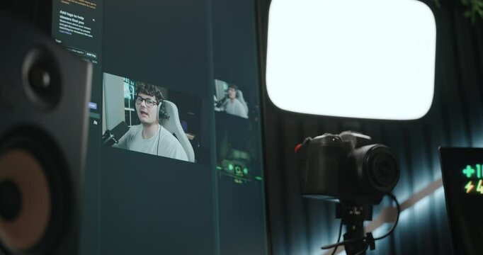 Young man playing video games and setting up a livestream