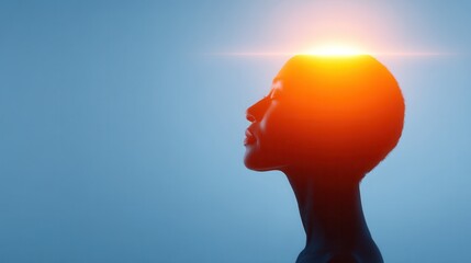 A silhouette of a person with a glowing light above their head, symbolizing ideas, creativity, or enlightenment against a blue background.