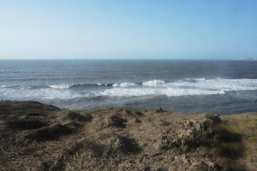 waves breaking on the beach