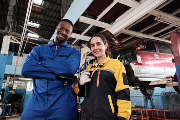 Happy professional teamwork, Latin female inspector engineer and Black mechanic are cheerful, smile...