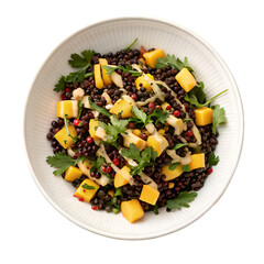 Black lentil salad with mango and tahini dressing top view isolated on white background