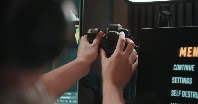 Video game live streamer adjusting microphone, camera, and stream 