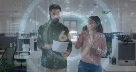 6G technology animation over colleagues discussing documents in modern office - Powered by Adobe