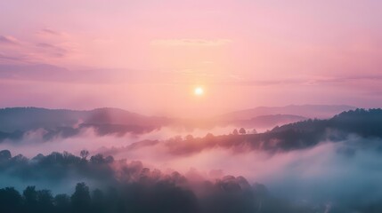 Obraz premium Serene sunrise over misty hills, showcasing nature's beauty and tranquility.
