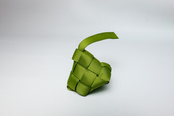Green Ribbon Ketupat Decoration on White Background