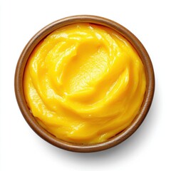 A close-up photo of a bowl of creamy mashed mango, on a white background 