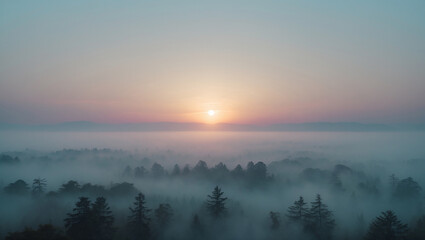 Obraz premium Ethereal Sunrise Over Foggy Forest Landscape With Pastel Sky And Mountain Silhouette