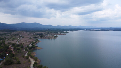 Aerial view of the rocky hill tourist or bukit batu attraction in the Riam Kanan Banjarbaru reservoir, which is surrounded by wide and beautiful waters