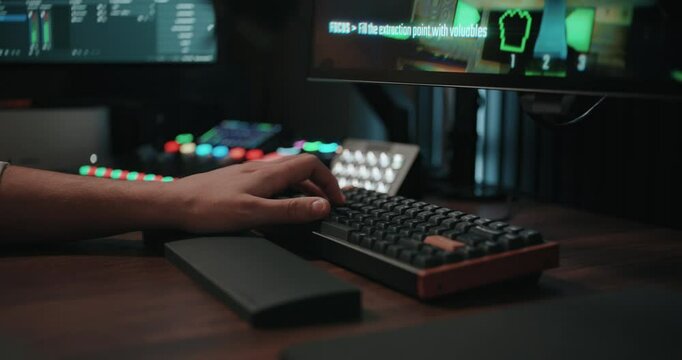 Video game live streamer&rsquo;s hands moving a keyboard and mouse