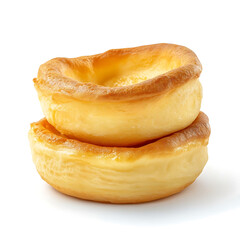 Fluffy and golden Yorkshire puddings with a light, airy texture and crisp edges, isolated white background