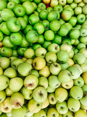 lots of ripe green apples in the food store
