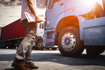 Truck Drivers Holding Clipboard to Check Truck Tires. Semi Truck Tractor, Big rig. Inspector...