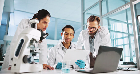 Fototapeta premium Group, scientist and clipboard in laboratory for medical innovation, research and analysis on laptop. Science discussion, people and computer for healthcare study, planning and medicine development