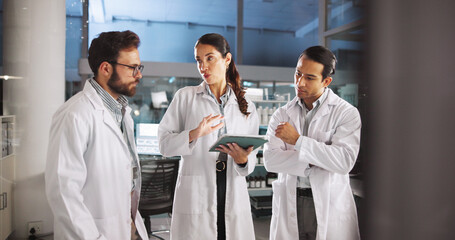 Scientist, talk and meeting on tablet in lab for research, medical investigation and pharmaceutical...
