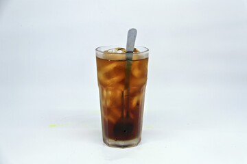 Unsweetened iced tea, known as Es Teh Tawar in Indonesia. A simple, refreshing drink served cold with ice cubes—perfect for cleansing the palate on a hot day.