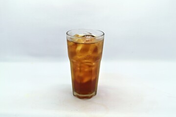 Unsweetened iced tea, known as Es Teh Tawar in Indonesia. A simple, refreshing drink served cold with ice cubes—perfect for cleansing the palate on a hot day.