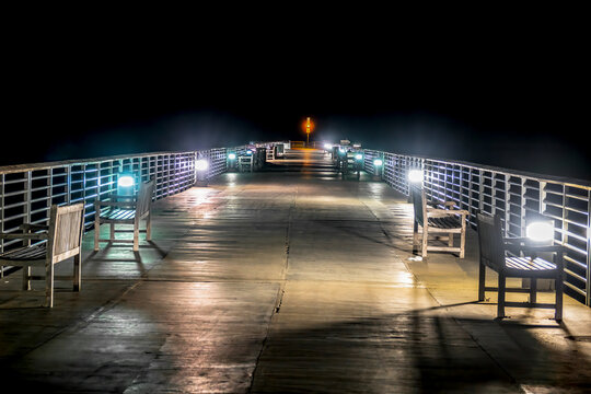 Night time on an empty pier - Powered by Adobe