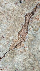 The old cement floor has cracks.