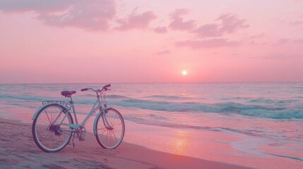 Fototapeta premium Bicycle on sandy sea coast against backdrop of pink idyllic sunset. Active vacation time
