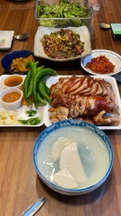 Jokbal, a Korean dish of braised pork hock, slow-cooked in a rich, savory sauce with soy, garlic, and spices. Tender and flavorful, it’s often served with lettuce wraps, garlic, and ssamjang