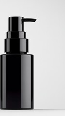 Obraz premium Sleek black dispenser stands prominently against a minimalist backdrop, exuding modern elegance and design. A visual representation of refinement and sophistication.