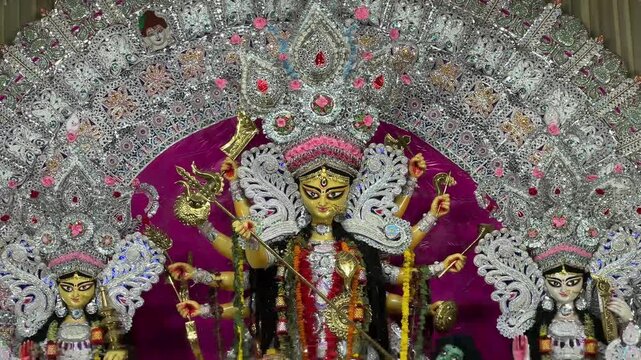 Close up shot of Goddess Durga Maa dressed in traditional Daker saj in Kolkata