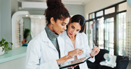 Tablet, women and optician in store for vision discussion, planning treatment or eyesight test...
