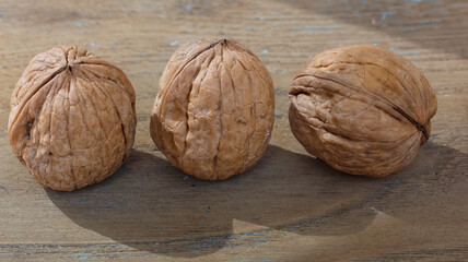 Walnuts on a wooden table.