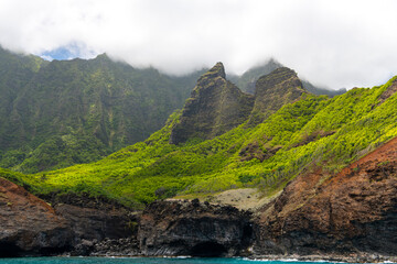 Dramatic cliffs and vibrant greenery along the Na Pali Coast, Kauai, Hawaii.