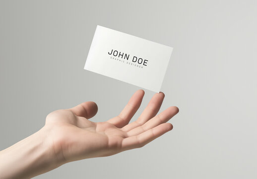 Business Card Floating Above A Hand Mockup