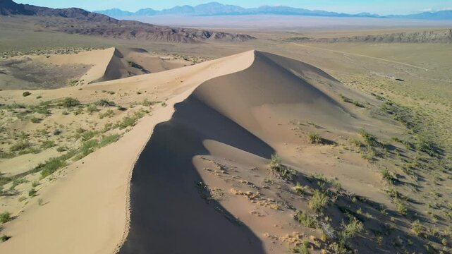 Sand dune ridge captured from above on a clear day.