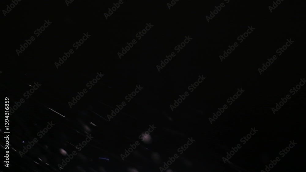 Poster abstract dark background with subtle light streaks and speckles