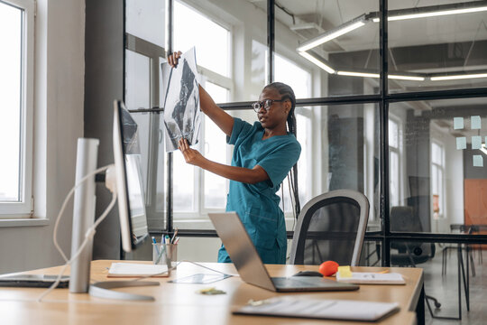 Female doctor in coat is in the office clinic