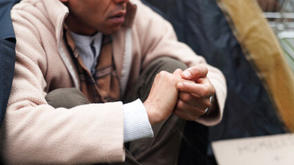 Homeless, poverty and winter with hands of person for depression, unemployment rate and crisis....