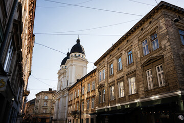 Historic street view with church in Lviv, Ukraine during daylight