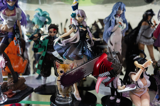 Collection of anime and manga figurines displayed on a shelf