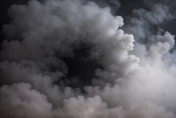 Dense fluffy gray fog on a black background, abstract clouds, all motion blurred