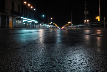 Wet asphalt with neon light. Blurred background, night lights of big city, reflection, puddles