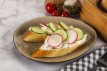Bruschetta with soft cheese and radishes